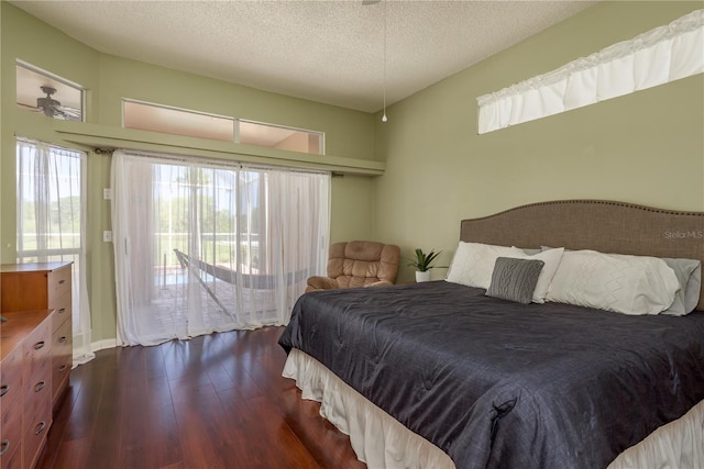 800 Belted Kingfisher Dr S, Palm Harbor, FL 34683 - bedroom featuring access to exterior, wood finished floors, and a textured ceiling