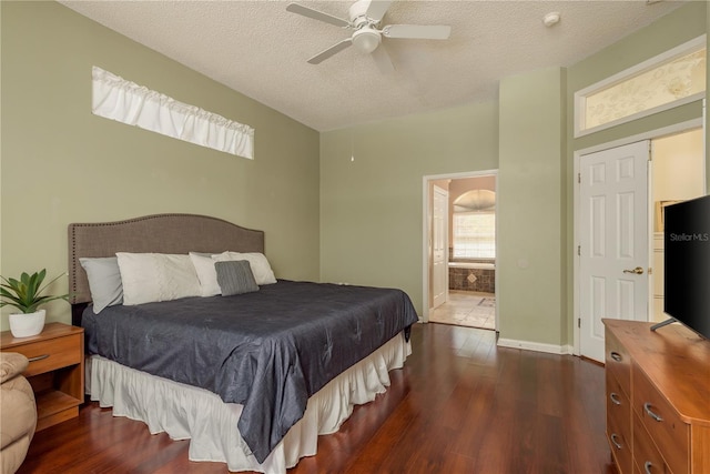 800 Belted Kingfisher Dr S, Palm Harbor, FL 34683 - bedroom featuring wood finished floors, a textured ceiling, ensuite bath, and a ceiling fan