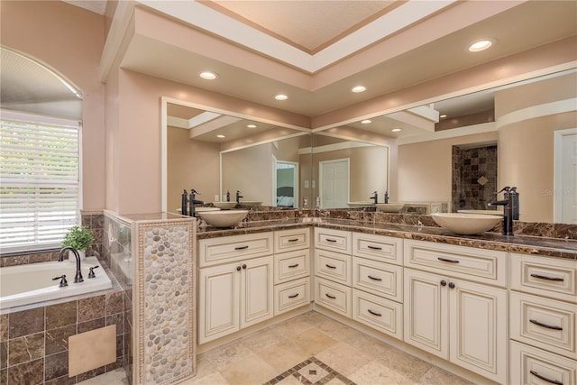 800 Belted Kingfisher Dr S, Palm Harbor, FL 34683 - full bathroom featuring double vanity, a garden tub, and recessed lighting