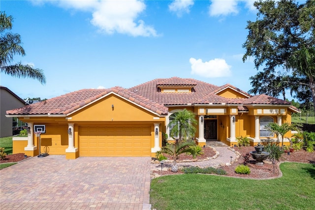 800 Belted Kingfisher Dr S, Palm Harbor, FL 34683 - mediterranean / spanish house with stucco siding, an attached garage, a front yard, a tiled roof, and decorative driveway