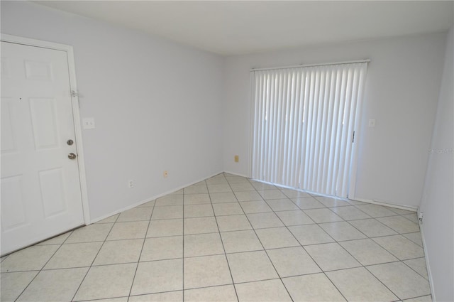 1400 Gandy Blvd N Unit 1705, Saint Petersburg, FL 33702 - spare room featuring light tile patterned flooring and baseboards