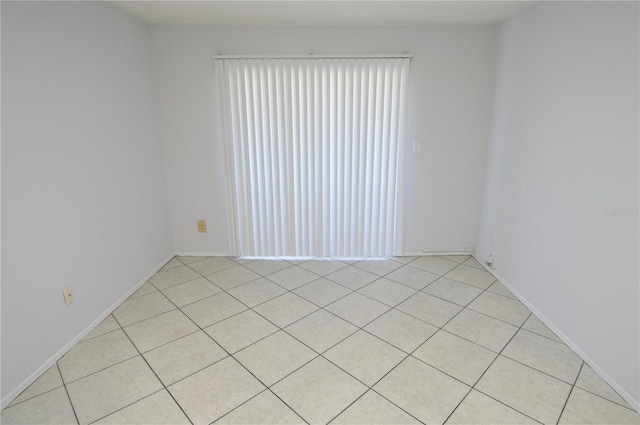 1400 Gandy Blvd N Unit 1705, Saint Petersburg, FL 33702 - spare room featuring light tile patterned floors and baseboards