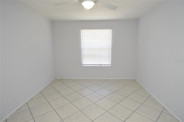 1400 Gandy Blvd N Unit 1705, Saint Petersburg, FL 33702 - empty room with ceiling fan, light tile patterned floors, and baseboards