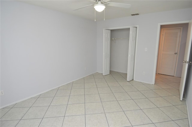 1400 Gandy Blvd N Unit 1705, Saint Petersburg, FL 33702 - unfurnished bedroom featuring a closet, ceiling fan, light tile patterned floors, and baseboards