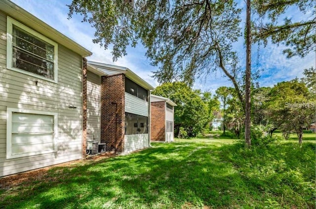 1400 Gandy Blvd N Unit 1705, Saint Petersburg, FL 33702 - view of grassy yard featuring a sunroom