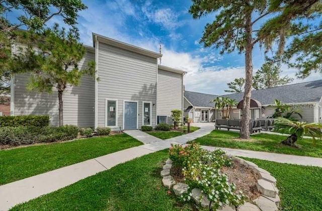 1400 Gandy Blvd N Unit 1705, Saint Petersburg, FL 33702 - back of house with a lawn