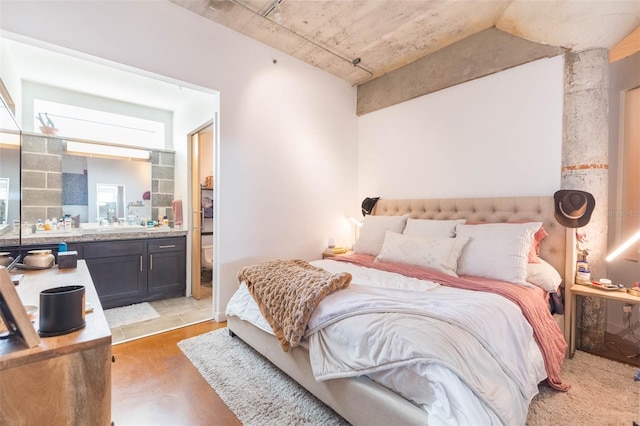 101 N 12th St Unit 400, Tampa, FL 33602 - bedroom featuring finished concrete floors and ensuite bath