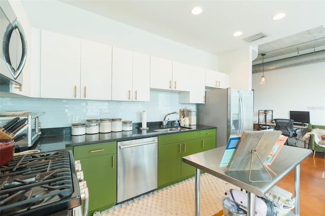101 N 12th St Unit 400, Tampa, FL 33602 - kitchen featuring stainless steel appliances, a sink, tasteful backsplash, dark countertops, and recessed lighting