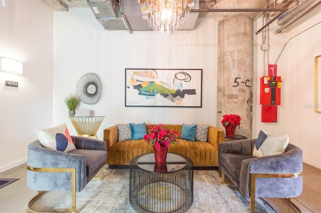 101 N 12th St Unit 400, Tampa, FL 33602 - living room featuring baseboards, a chandelier, and concrete flooring