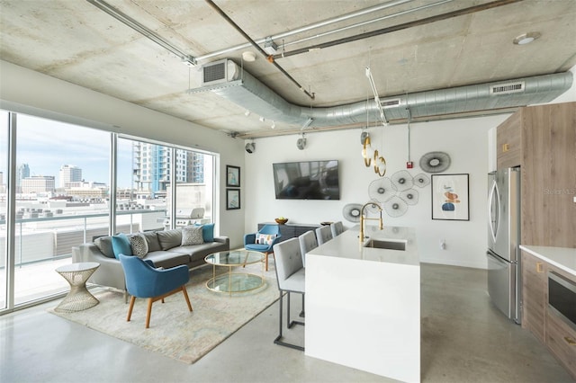 101 N 12th St Unit 400, Tampa, FL 33602 - living area with a view of city and finished concrete floors