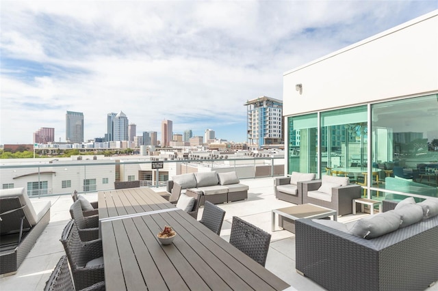 101 N 12th St Unit 400, Tampa, FL 33602 - wooden terrace featuring an outdoor hangout area, a skyline view, and outdoor dining area