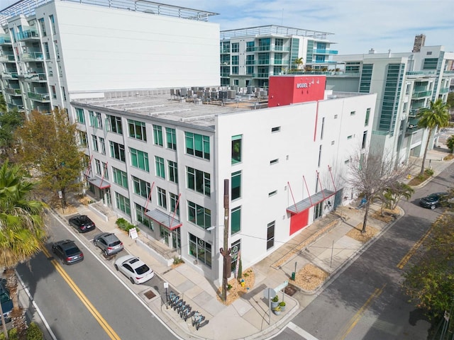 101 N 12th St Unit 400, Tampa, FL 33602 - view of apartment building / complex featuring a view of city, central air condition unit, and uncovered parking