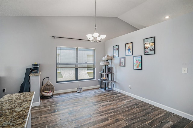 6118 Becklin Pl, Riverview, FL 33578 - dining space featuring a chandelier, dark wood-type flooring, baseboards, lofted ceiling, and recessed lighting