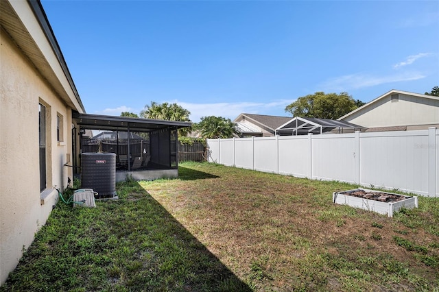 6118 Becklin Pl, Riverview, FL 33578 - view of yard featuring central AC unit, a garden, and a sunroom