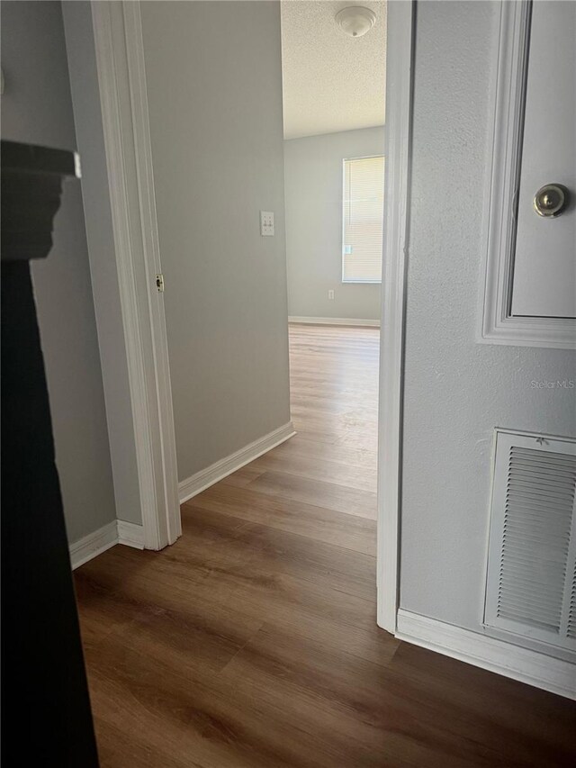 6025 Osprey Lake Cir, Riverview, FL 33578 - hallway with wood finished floors and baseboards