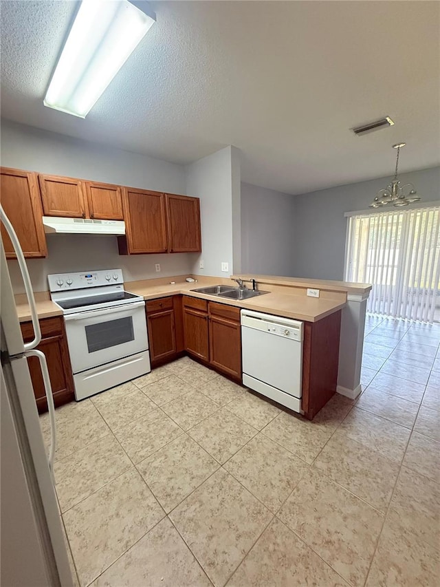 6025 Osprey Lake Cir, Riverview, FL 33578 - kitchen featuring white appliances, under cabinet range hood, a sink, a chandelier, and light countertops