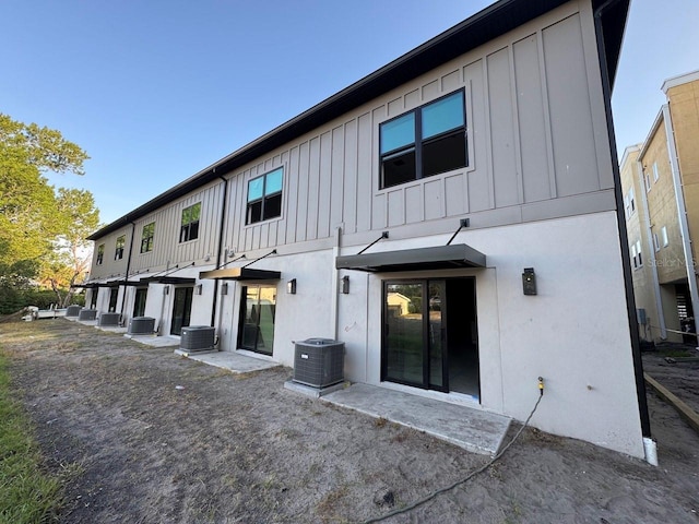 4308 W Gray St Unit 1Thru 6, Tampa, FL 33609 - rear view of house with board and batten siding and central air condition unit