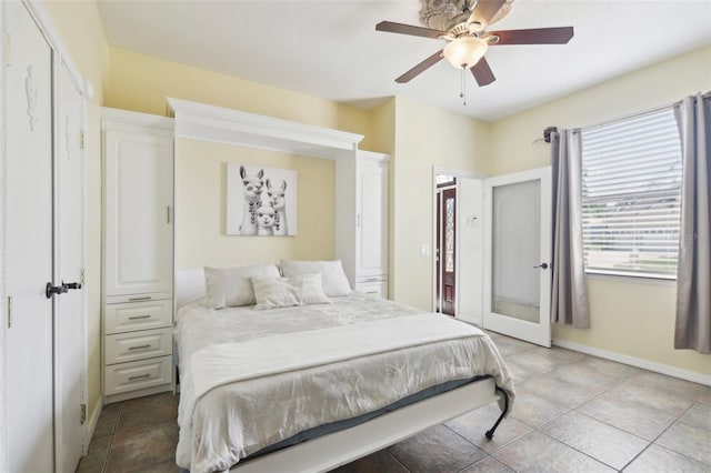 11029 Lynn Lake Cir, Tampa, FL 33625 - bedroom featuring light tile patterned floors, baseboards, and ceiling fan