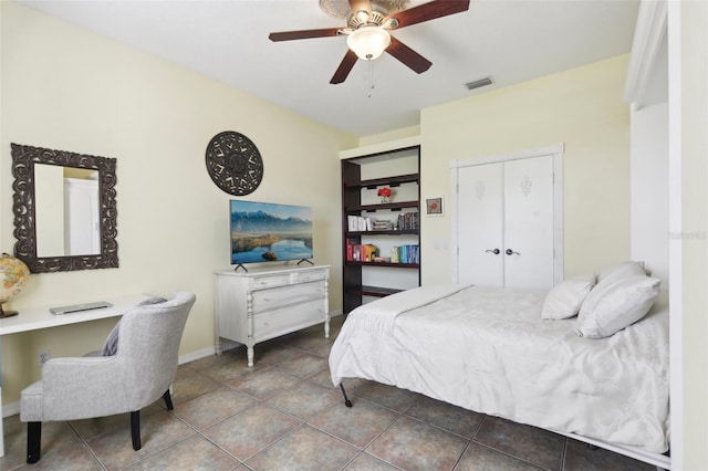 11029 Lynn Lake Cir, Tampa, FL 33625 - bedroom featuring a closet, tile patterned floors, ceiling fan, and baseboards