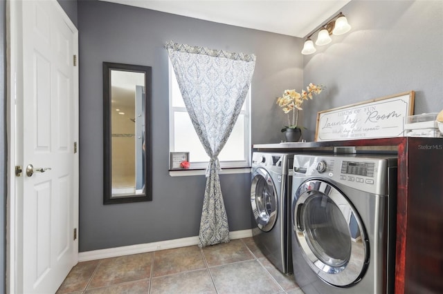 11029 Lynn Lake Cir, Tampa, FL 33625 - washroom featuring washing machine and dryer, baseboards, and tile patterned flooring