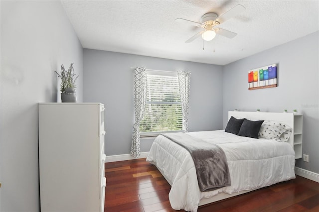 11029 Lynn Lake Cir, Tampa, FL 33625 - bedroom with wood finished floors, baseboards, a textured ceiling, and a ceiling fan