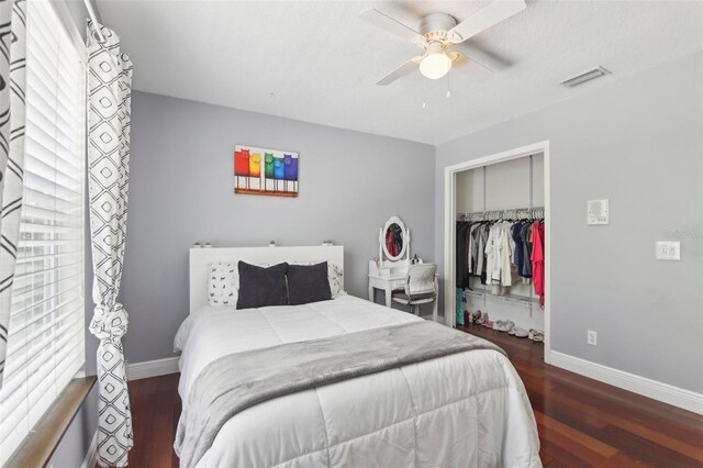 11029 Lynn Lake Cir, Tampa, FL 33625 - bedroom with a closet, baseboards, and wood finished floors