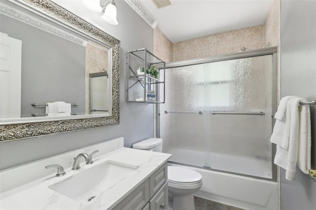 11029 Lynn Lake Cir, Tampa, FL 33625 - full bath featuring toilet, vanity, enclosed tub / shower combo, and tile patterned floors