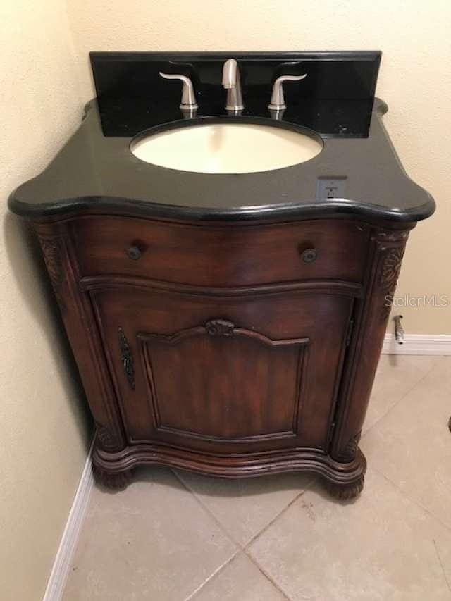 17220 Estes Rd, Lutz, FL 33548 - bathroom view of vanity and baseboards