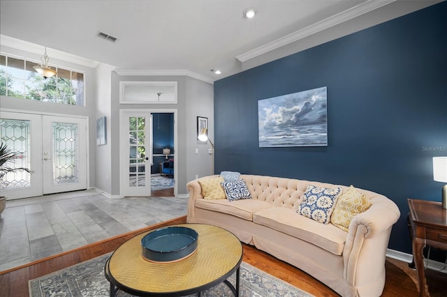 2903 Manor Ridge Pl, Valrico, FL 33596 - living area with crown molding, french doors, recessed lighting, wood finished floors, and baseboards