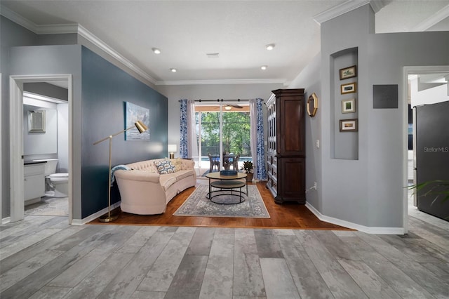 2903 Manor Ridge Pl, Valrico, FL 33596 - living room with hardwood / wood-style flooring, baseboards, and crown molding