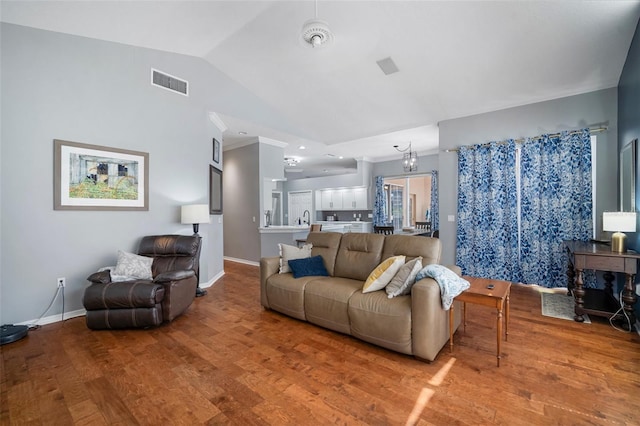 2903 Manor Ridge Pl, Valrico, FL 33596 - living area with wood finished floors, lofted ceiling, and baseboards