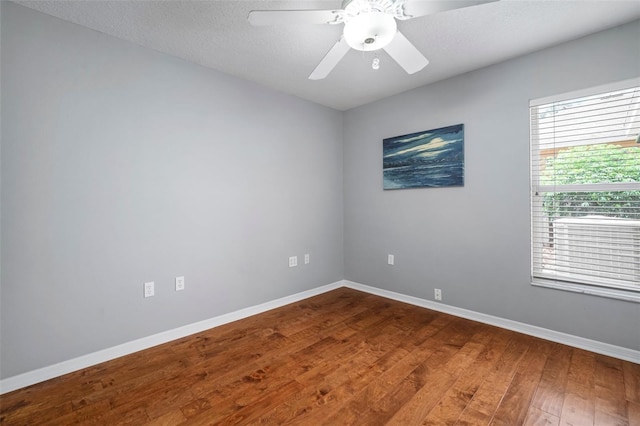 2903 Manor Ridge Pl, Valrico, FL 33596 - empty room featuring wood finished floors, baseboards, and ceiling fan