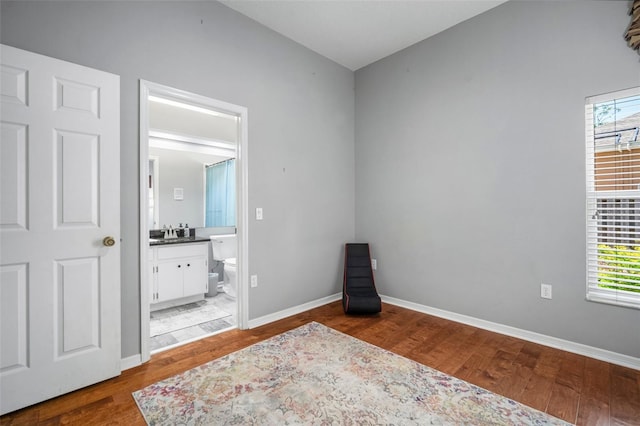 2903 Manor Ridge Pl, Valrico, FL 33596 - bedroom with wood finished floors, baseboards, and ensuite bath
