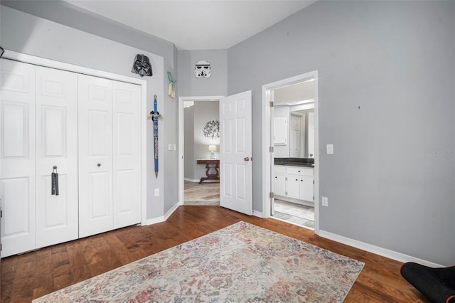 2903 Manor Ridge Pl, Valrico, FL 33596 - bedroom featuring a closet, wood finished floors, and baseboards