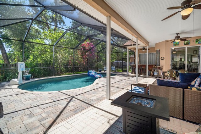 2903 Manor Ridge Pl, Valrico, FL 33596 - view of pool featuring a patio, a ceiling fan, an outdoor fire pit, and glass enclosure