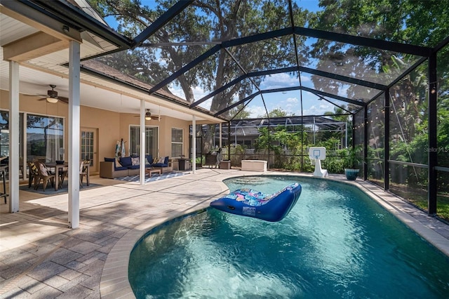 2903 Manor Ridge Pl, Valrico, FL 33596 - swimming pool with a ceiling fan, an outdoor living space, a patio area, and glass enclosure