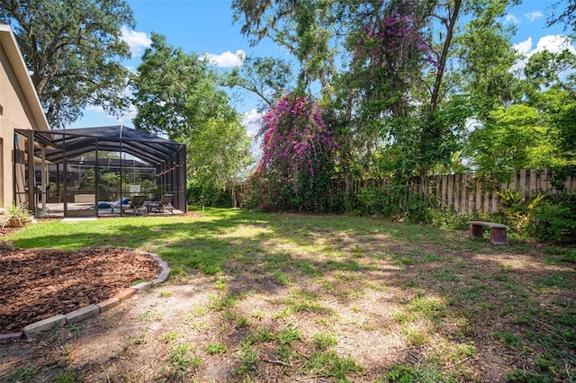 2903 Manor Ridge Pl, Valrico, FL 33596 - view of yard featuring glass enclosure and a patio area