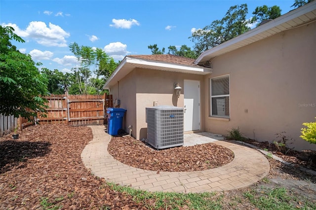 2903 Manor Ridge Pl, Valrico, FL 33596 - exterior view of stucco siding and central AC unit