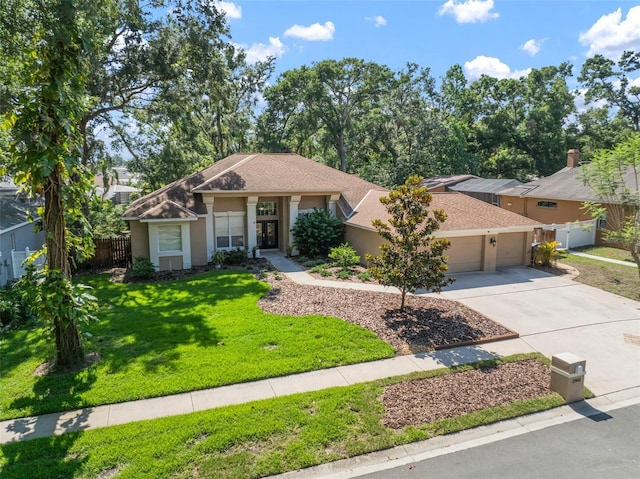 2903 Manor Ridge Pl, Valrico, FL 33596 - view of front of home with an attached garage, stucco siding, concrete driveway, and a shingled roof