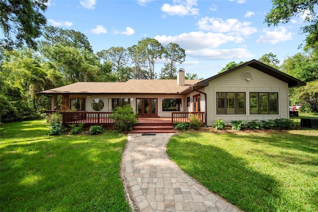 8011 N Mobley Rd, Odessa, FL 33556 - single story home with a deck, a chimney, and a front yard