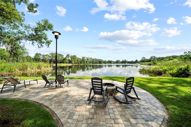 8011 N Mobley Rd, Odessa, FL 33556 - view of patio featuring a fire pit and a water view