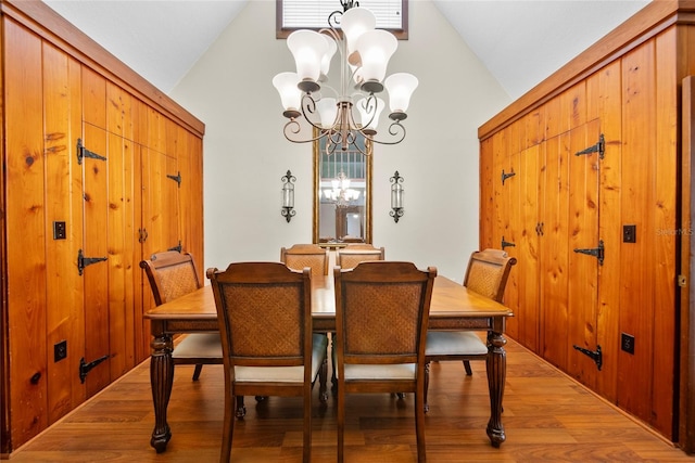 8011 N Mobley Rd, Odessa, FL 33556 - dining space featuring a chandelier, high vaulted ceiling, and light wood-type flooring