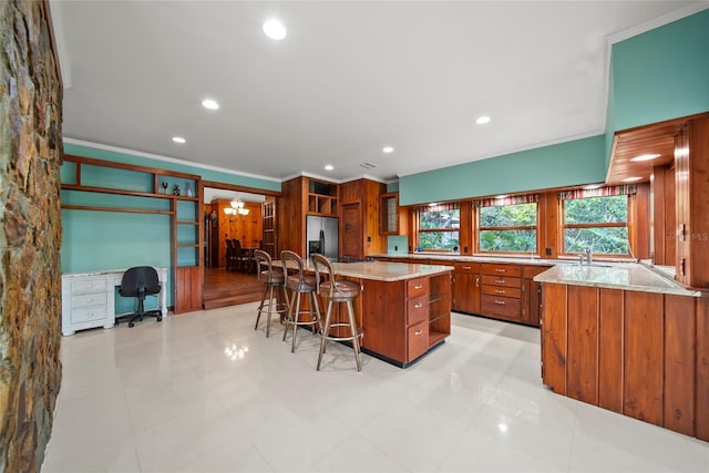 8011 N Mobley Rd, Odessa, FL 33556 - kitchen featuring brown cabinetry, stainless steel refrigerator with ice dispenser, a chandelier, a kitchen breakfast bar, and open shelves