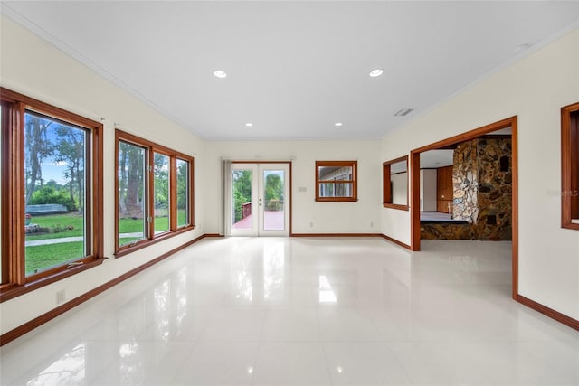 8011 N Mobley Rd, Odessa, FL 33556 - spare room featuring baseboards, crown molding, plenty of natural light, french doors, and recessed lighting