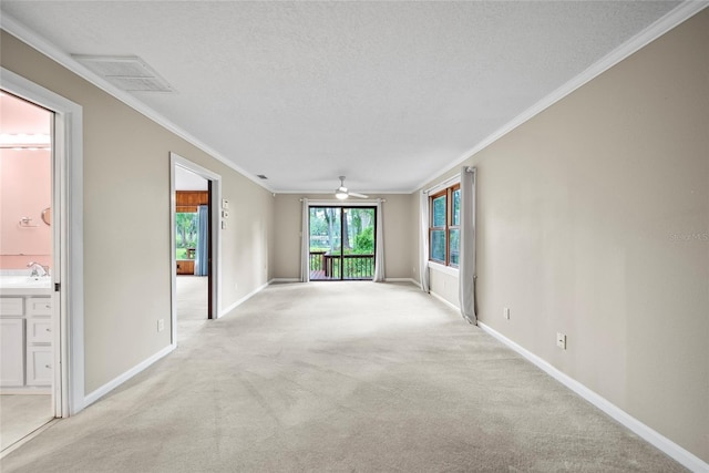 8011 N Mobley Rd, Odessa, FL 33556 - empty room featuring light carpet, a textured ceiling, baseboards, ornamental molding, and ceiling fan