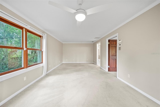 8011 N Mobley Rd, Odessa, FL 33556 - spare room with ornamental molding, a ceiling fan, baseboards, and light colored carpet