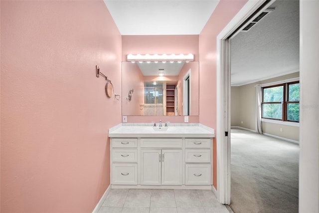 8011 N Mobley Rd, Odessa, FL 33556 - bathroom with baseboards, vanity, and tile patterned flooring