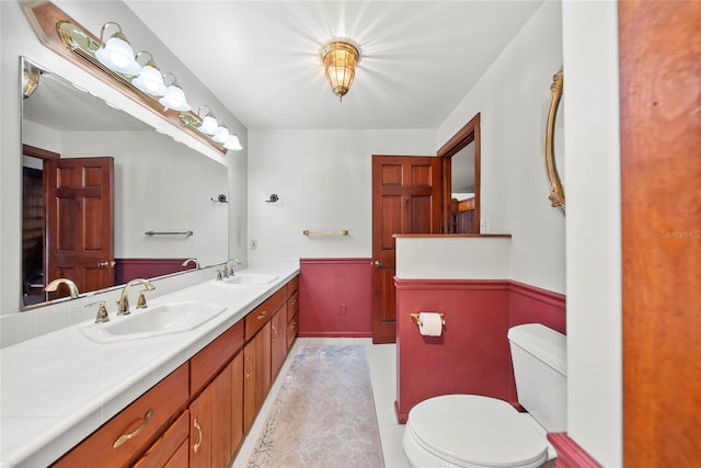 8011 N Mobley Rd, Odessa, FL 33556 - bathroom featuring double vanity and toilet