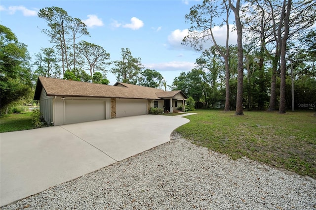 8011 N Mobley Rd, Odessa, FL 33556 - single story home featuring driveway, an attached garage, a front yard, and a shingled roof