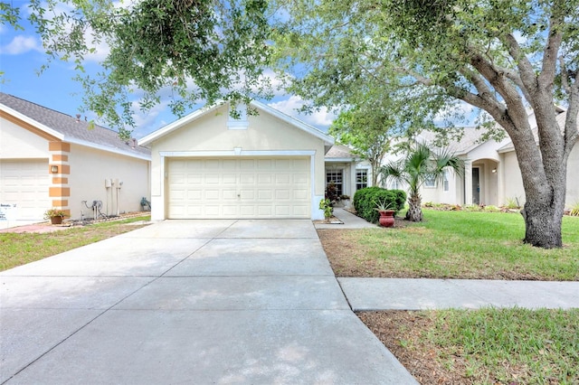ranch-style house featuring driveway, a garage, a front lawn, and stucco siding